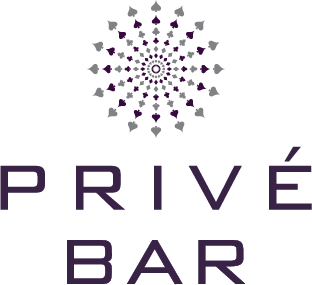 Logo for "PRIVÉ BAR" at River Rock Casino Resort, featuring purple and gray spade shapes forming a circular, mandala-like pattern above the text.